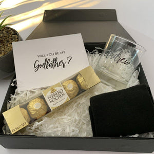 god father gift box that includes chocolates, card, socks etc