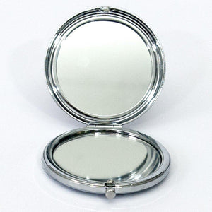 open silver compact mirror