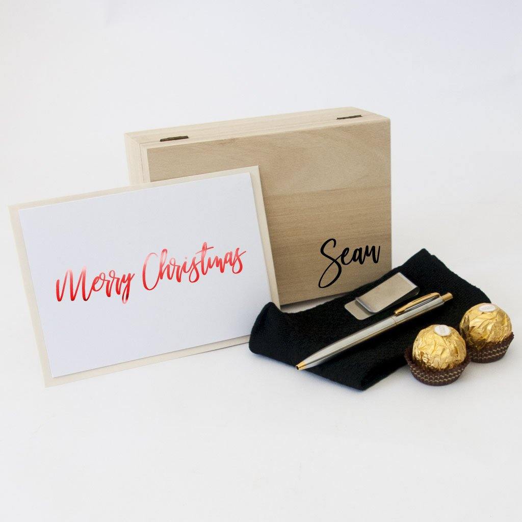 Timber gift box, black bamboo socks, stainless steel two toned pen, stainless steel money clip, ferrero rocher chocolates, personalised christmas card